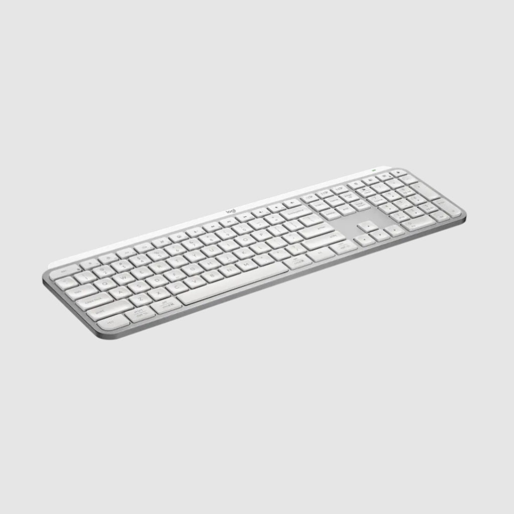 A slim white wireless computer keyboard with a matching white trackpad, shown at an angle on a light gray background.