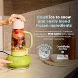 Green Ninja blender with ingredients inside on a countertop, featuring text about its features.